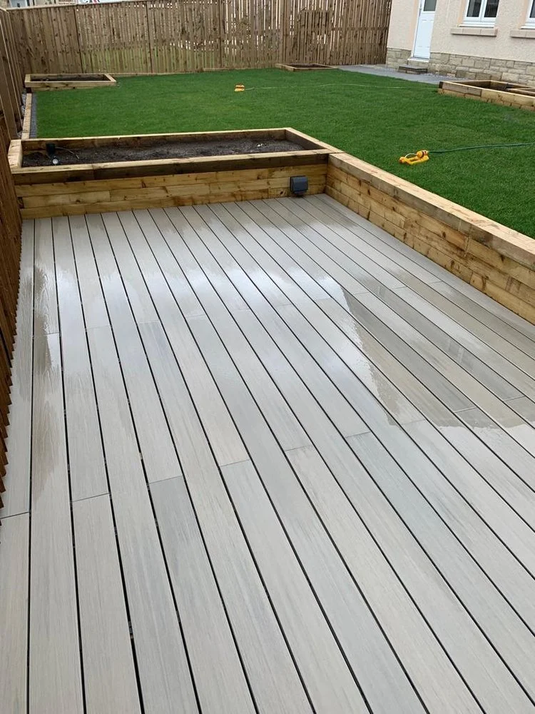 Grey decking with a large raised planter