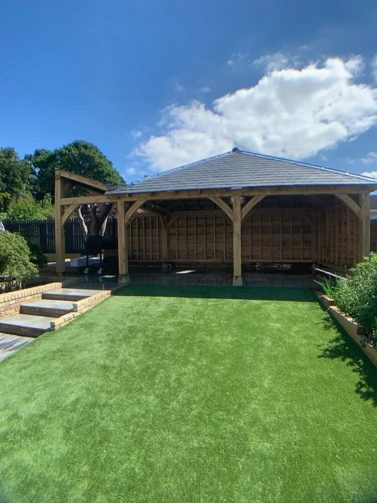 Wooden gazebo on a manicured lawn